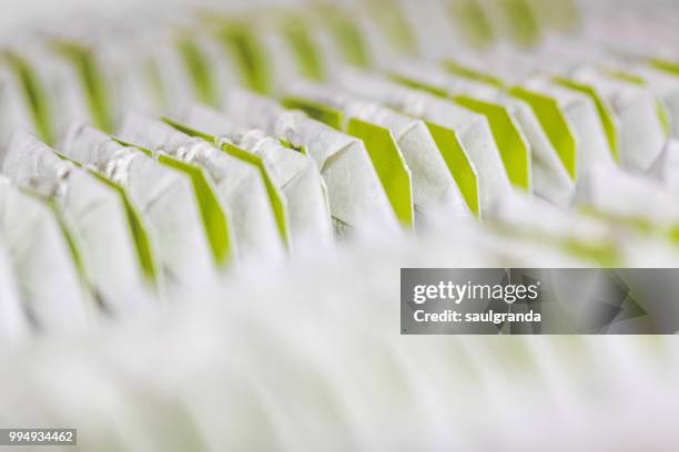 close-up of teabags in a row - tea bags stock pictures, royalty-free photos & images