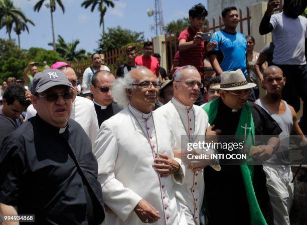 Cardinal Leopoldo Brenes and bishop Silvio Baez arrive at the San Sebastian Basilica in Diriamba, Nicaragua, on July 9, 2018 where they were harassed...