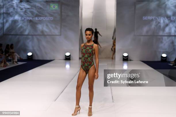 Model presents swimwear creation at the International Exhibition of Lingerie, 'Salon De La Lingerie' Summer Collection at Parc des Expositions Porte...