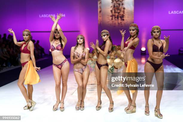 Models present swimwear creation at the International Exhibition of Lingerie, 'Salon De La Lingerie' Summer Collection at Parc des Expositions Porte...