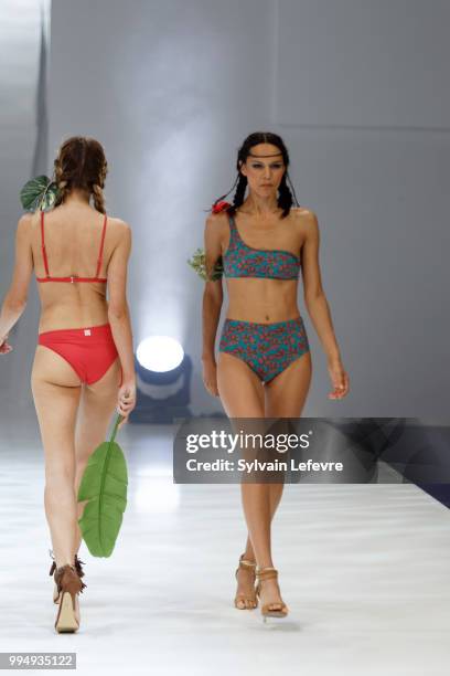 Models present swimwear creation at the International Exhibition of Lingerie, 'Salon De La Lingerie' Summer Collection at Parc des Expositions Porte...