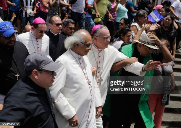 Cardinal Leopoldo Brenes and bishop Silvio Baez arrive at the San Sebastian Basilica in Diriamba, Nicaragua, on July 9, 2018 where they were harassed...