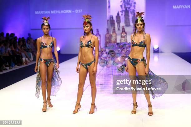 Models present swimwear creation at the International Exhibition of Lingerie, 'Salon De La Lingerie' Summer Collection at Parc des Expositions Porte...