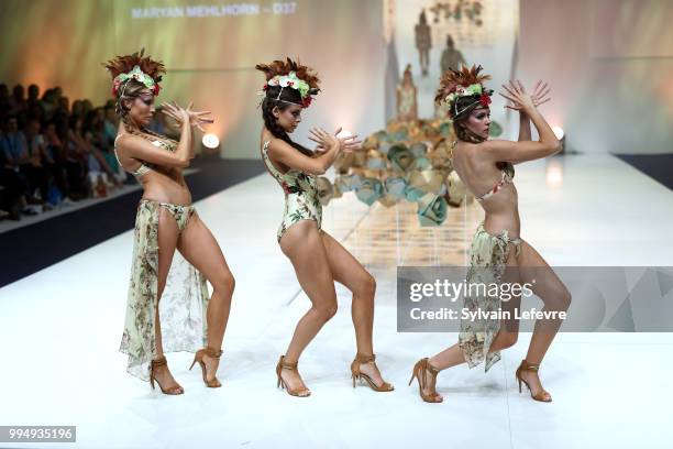 Models present swimwear creation at the International Exhibition of Lingerie, 'Salon De La Lingerie' Summer Collection at Parc des Expositions Porte...