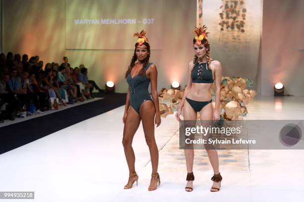 Models present swimwear creation at the International Exhibition of Lingerie, 'Salon De La Lingerie' Summer Collection at Parc des Expositions Porte...