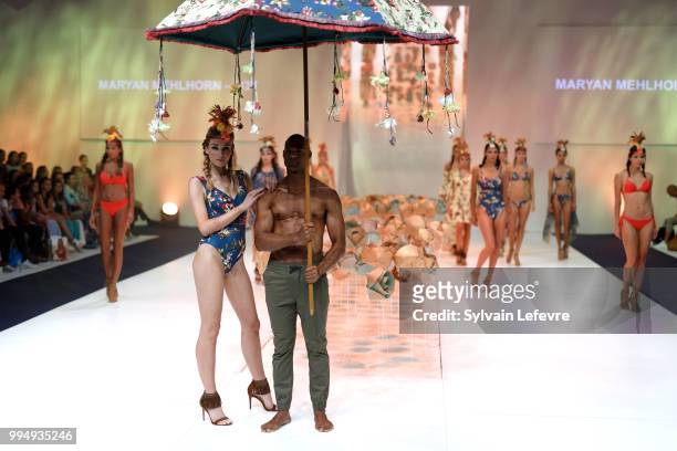 Models present swimwear creation at the International Exhibition of Lingerie, 'Salon De La Lingerie' Summer Collection at Parc des Expositions Porte...