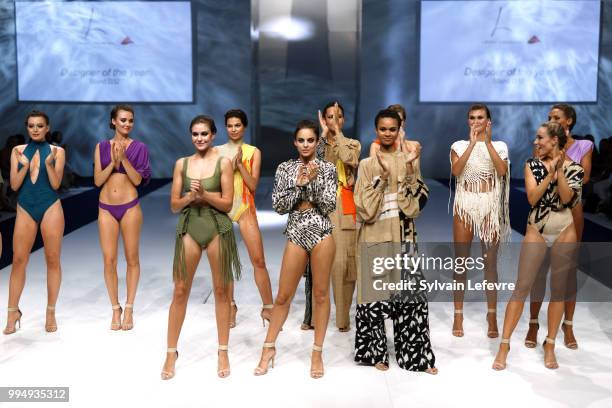 Models present swimwear creation at the International Exhibition of Lingerie, 'Salon De La Lingerie' Summer Collection at Parc des Expositions Porte...