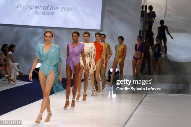 Models present swimwear creation at the International Exhibition of Lingerie, 'Salon De La Lingerie' Summer Collection at Parc des Expositions Porte...