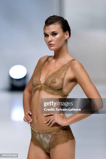 Model presents underwear creation at the International Exhibition of Lingerie, 'Salon De La Lingerie' Summer Collection at Parc des Expositions Porte...