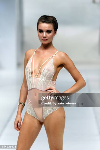 Model presents underwear creation at the International Exhibition of Lingerie, 'Salon De La Lingerie' Summer Collection at Parc des Expositions Porte...