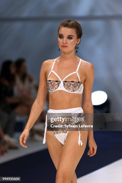 Model presents underwear creation at the International Exhibition of Lingerie, 'Salon De La Lingerie' Summer Collection at Parc des Expositions Porte...