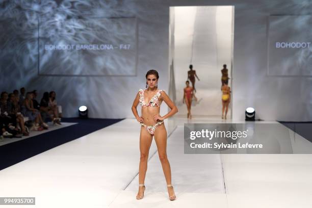 Model presents swimwear creation at the International Exhibition of Lingerie, 'Salon De La Lingerie' Summer Collection at Parc des Expositions Porte...