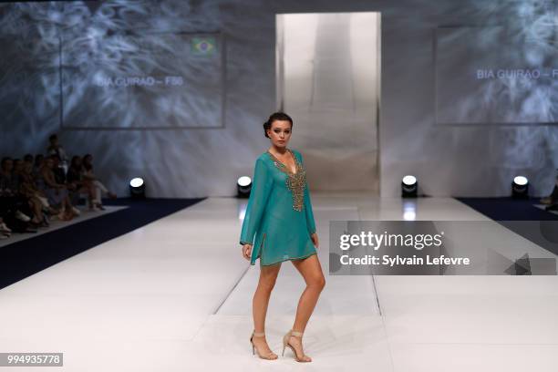 Model presents swimwear creation at the International Exhibition of Lingerie, 'Salon De La Lingerie' Summer Collection at Parc des Expositions Porte...