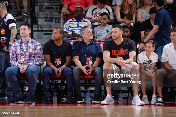 General Manager Koby Altman, owner Dan Gilbert, and Larry Nance Jr. #22 of the Cleveland Cavaliers attend the game against the Indiana Pacers during...