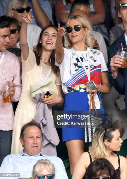 Alexa Chung and Poppy Delevingne attend day seven of the Wimbledon Tennis Championships at the All England Lawn Tennis and Croquet Club on July 9,...