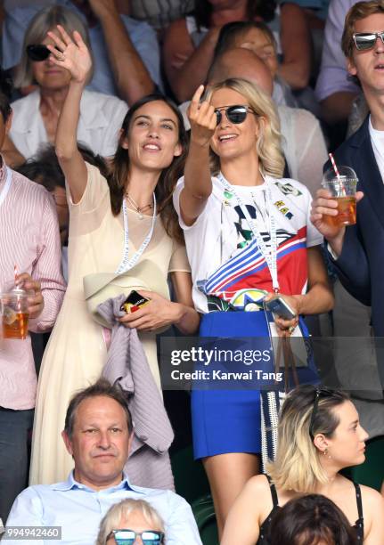 Alexa Chung and Poppy Delevingne attend day seven of the Wimbledon Tennis Championships at the All England Lawn Tennis and Croquet Club on July 9,...