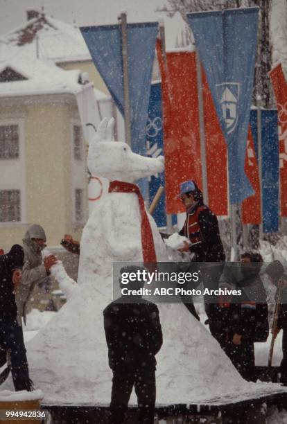 Sarajevo, Bosnia-Herzegovina People building snowman at opening ceremonies at the 1984 Winter Olympics / XIV Olympic Winter Games, Kosevo Stadium.