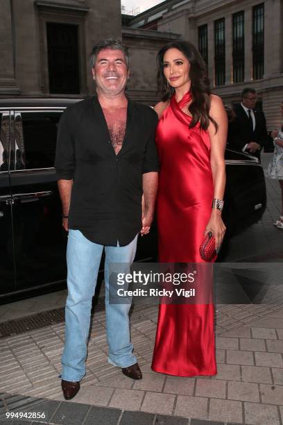 Simon Cowell and Lauren Silverman seen attending Syco - summer party at Victoria and Albert Museum on July 9, 2018 in London, England.