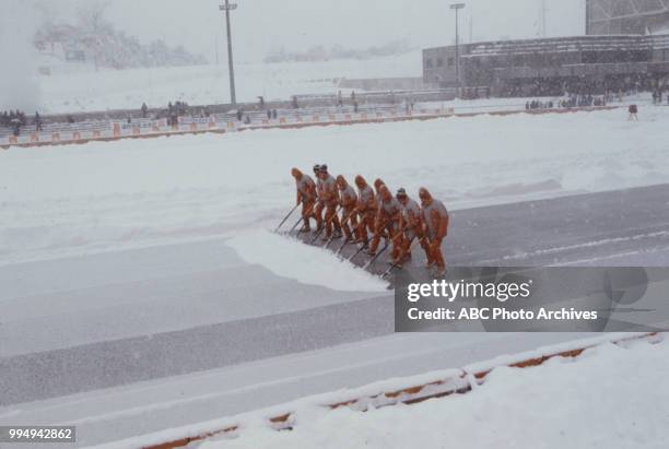 Sarajevo, Bosnia-Herzegovina Crew cleaning track at the opening ceremonies at the 1984 Winter Olympics / XIV Olympic Winter Games, Kosevo Stadium.