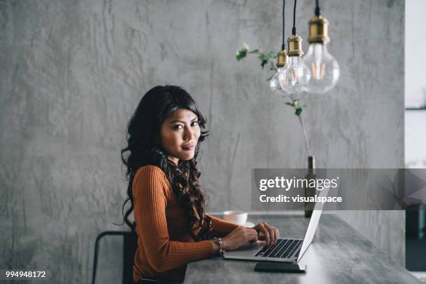 portrait of businesswoman working at home - saturated color stock pictures, royalty-free photos & images