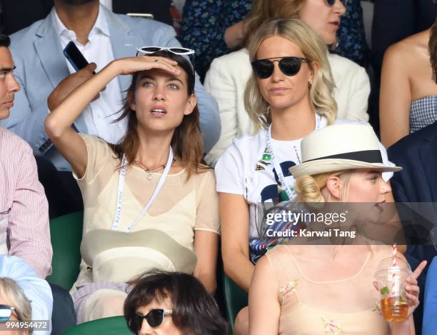 Alexa Chung and Poppy Delevingne attend day seven of the Wimbledon Tennis Championships at the All England Lawn Tennis and Croquet Club on July 9,...