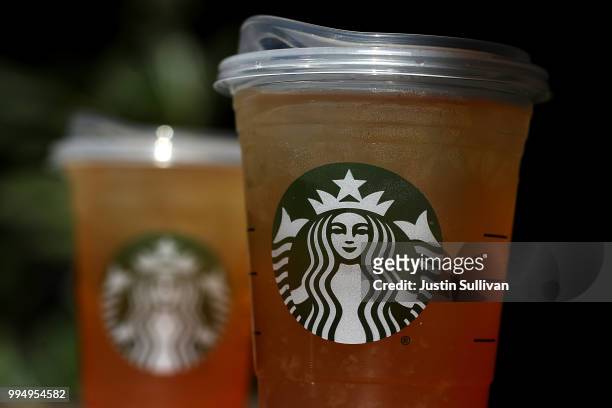 New flat plastic lid that does not need a straw is shown on a cup of Starbucks iced tea on July 9, 2018 in Sausalito, California. Starbucks announced...