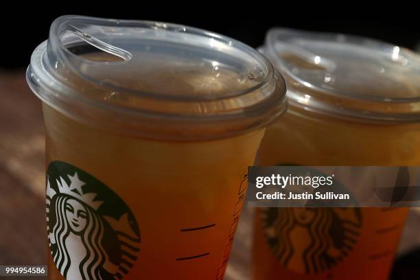 New flat plastic lid that does not need a straw is shown on a cup of Starbucks iced tea on July 9, 2018 in Sausalito, California. Starbucks announced...