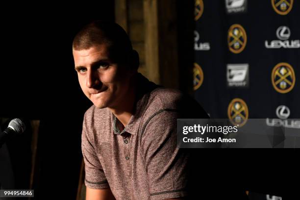 Nikola Jokic waiting for the start of a press conference for Josh Kroenke, vice chairman of Kroenke Sports and Entertainment and the Nuggets announce...