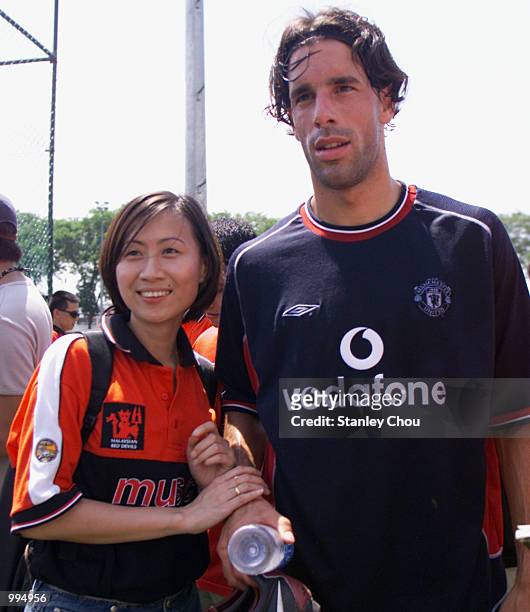 Manchester United Fan poses for photograph with Dutch Star Ruud Van Nistelrooy during Manchester United's Training Session at the Fam Training Ground...