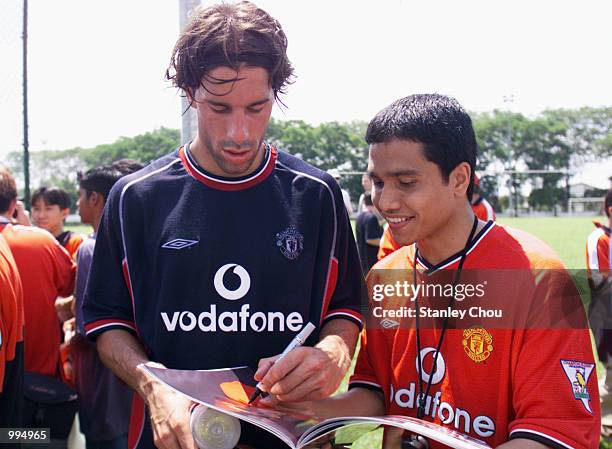 Ruud Van Nistelrooy of Manchester United signs autograph for Fans after a Training Session held at the Fam Training Ground in Petaling Jaya, Malaysia...