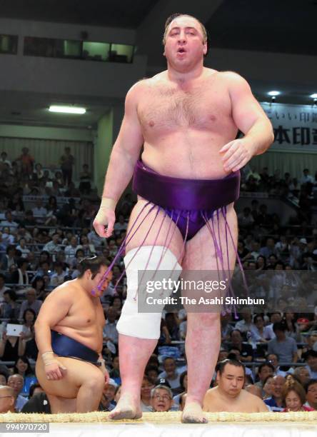 Georgian ozeki Tochinoshin reacts after his victory over Chiyonokuni on day two of the Grand Sumo Nagoya Tournament at the Dolphin's Arena on July 9,...