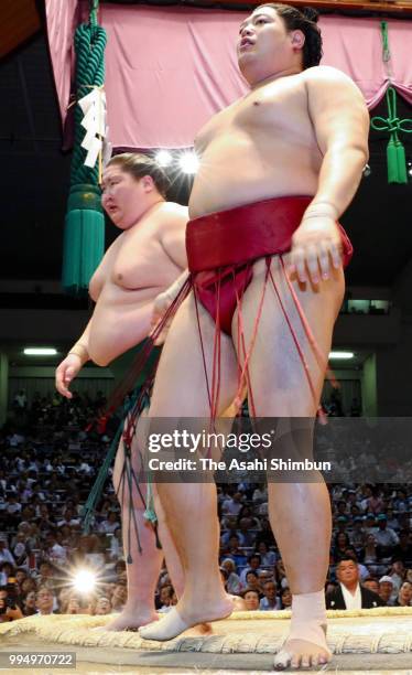 Abi reacts after his defeat by Mongolian sekiwake Ichinojo on day two of the Grand Sumo Nagoya Tournament at the Dolphin's Arena on July 9, 2018 in...