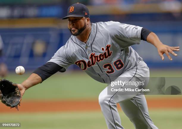 Francisco Liriano of the Detroit Tigers fumbles a hit from Wilson Ramos of the Tampa Bay Rays in the first inning of a baseball game at Tropicana...