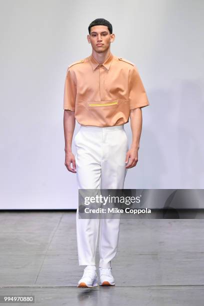 Model walks the runway at the Carlos Campos show - Runway - July 2018 New York City Men's Fashion Week at Industria Studios on July 9, 2018 in New...