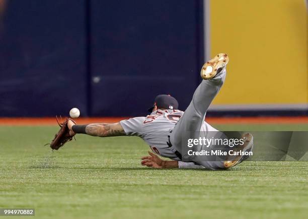 Nicholas Castellanos of the Detroit Tigers misplays a fly ball from Adeiny Hechavarria of the Tampa Bay Rays in the first inning of a baseball game...