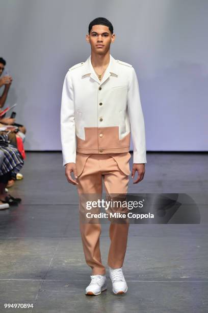 Model walks the runway at the Carlos Campos show - Runway - July 2018 New York City Men's Fashion Week at Industria Studios on July 9, 2018 in New...