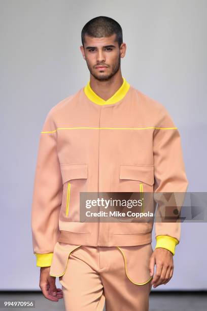 Model walks the runway at the Carlos Campos show - Runway - July 2018 New York City Men's Fashion Week at Industria Studios on July 9, 2018 in New...