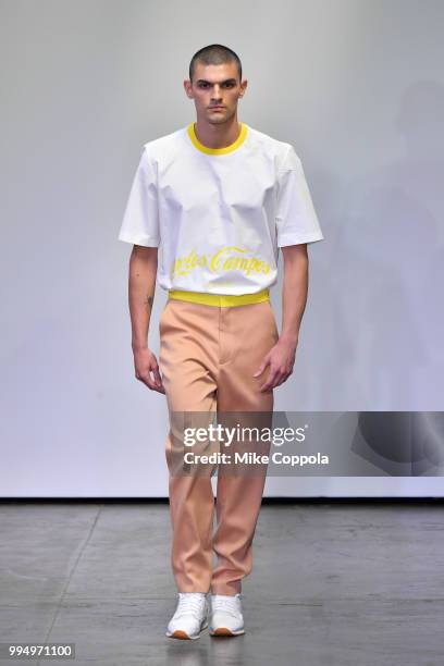 Model walks the runway at the Carlos Campos show - Runway - July 2018 New York City Men's Fashion Week at Industria Studios on July 9, 2018 in New...