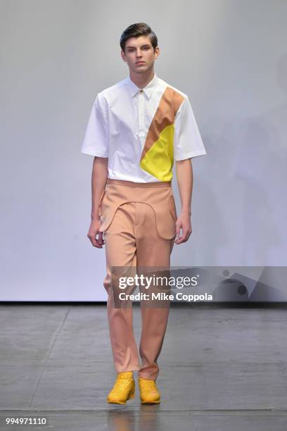 Model walks the runway at the Carlos Campos show - Runway - July 2018 New York City Men's Fashion Week at Industria Studios on July 9, 2018 in New...