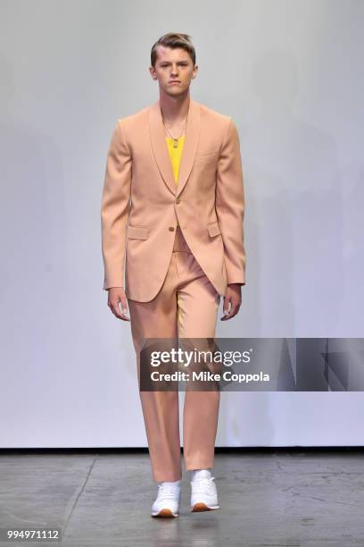 Model walks the runway at the Carlos Campos show - Runway - July 2018 New York City Men's Fashion Week at Industria Studios on July 9, 2018 in New...