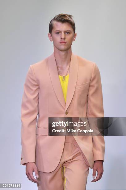 Model walks the runway at the Carlos Campos show - Runway - July 2018 New York City Men's Fashion Week at Industria Studios on July 9, 2018 in New...