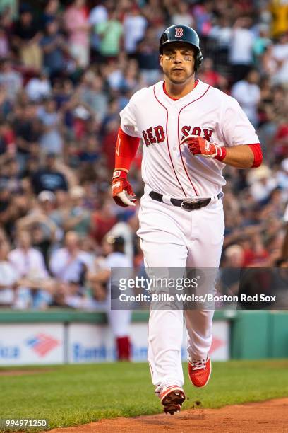Steve Pearce of the Boston Red Sox runs toward home plate after hitting a two-run home run during the first inning of a game against the Texas...
