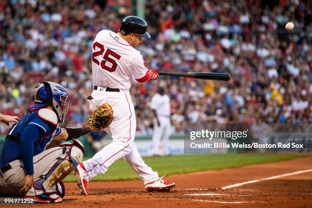 Steve Pearce of the Boston Red Sox hits a two-run home run during the first inning of a game against the Texas Rangers on July 9, 2018 at Fenway Park...