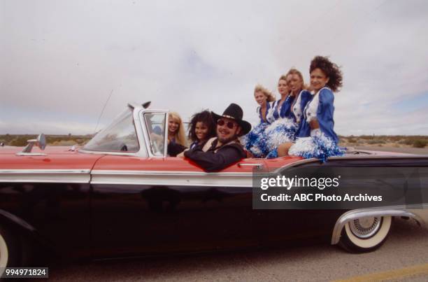 Hank Williams Jr and the Dallas Cowboy Cheerleaders for Walt Disney Television via Getty Images Sports.