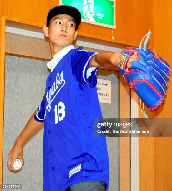 Year-old Kaito Yuki poses for photographs during a press conference announcing that he signs a minor contract with Kansas City Royals at Kanan City...