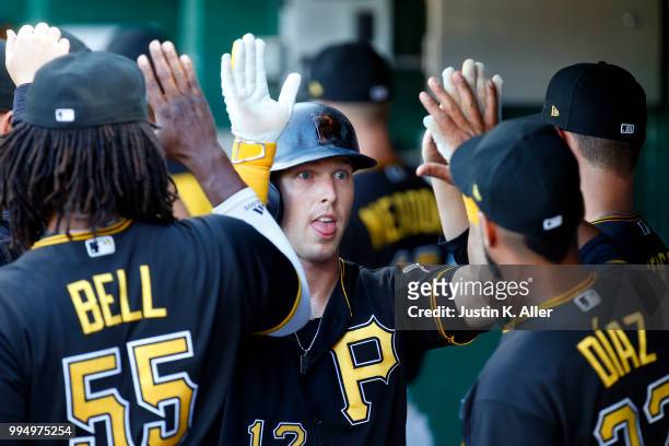 Corey Dickerson of the Pittsburgh Pirates celebrates after scoring on a two RBI single in the first inning against the Washington Nationals at PNC...
