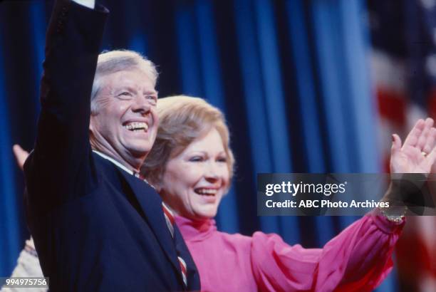 President Jimmy Carter, First Lady Rosalynn Carter waving to crowd.