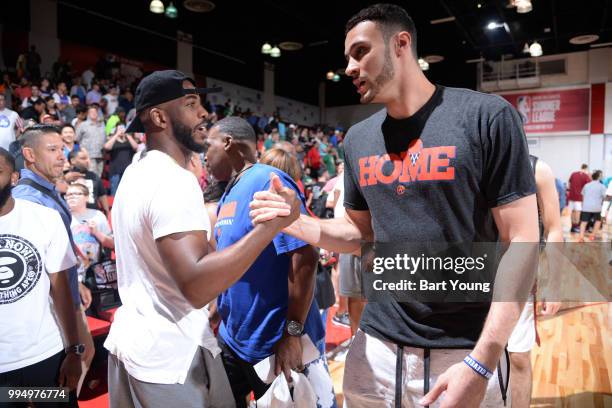 Chris Paul of the Houston Rockets shakes hands with Larry Nance Jr. #22 of the Cleveland Cavaliers during the 2018 Las Vegas Summer League on July 9,...