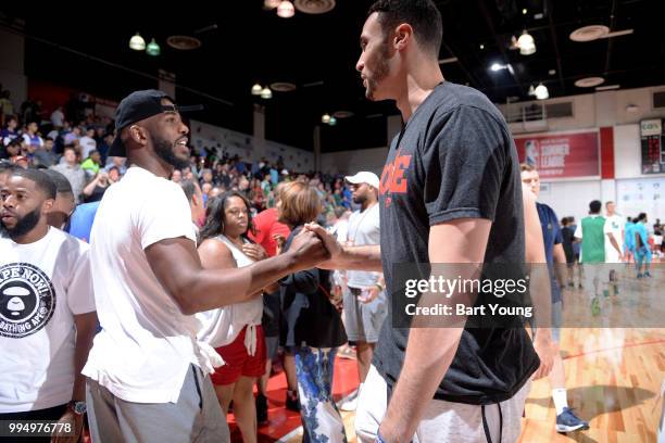 Chris Paul of the Houston Rockets shakes hands with Larry Nance Jr. #22 of the Cleveland Cavaliers during the 2018 Las Vegas Summer League on July 9,...