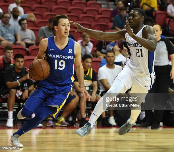 Josh Magette of the Golden State Warriors drives against Jalen Jones of the Dallas Mavericks during the 2018 NBA Summer League at the Thomas & Mack...